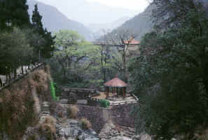 Valley below the mountains