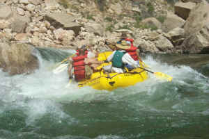 Hydro and team surfing a rapid